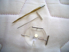 Size comparison of pin with longarm needle